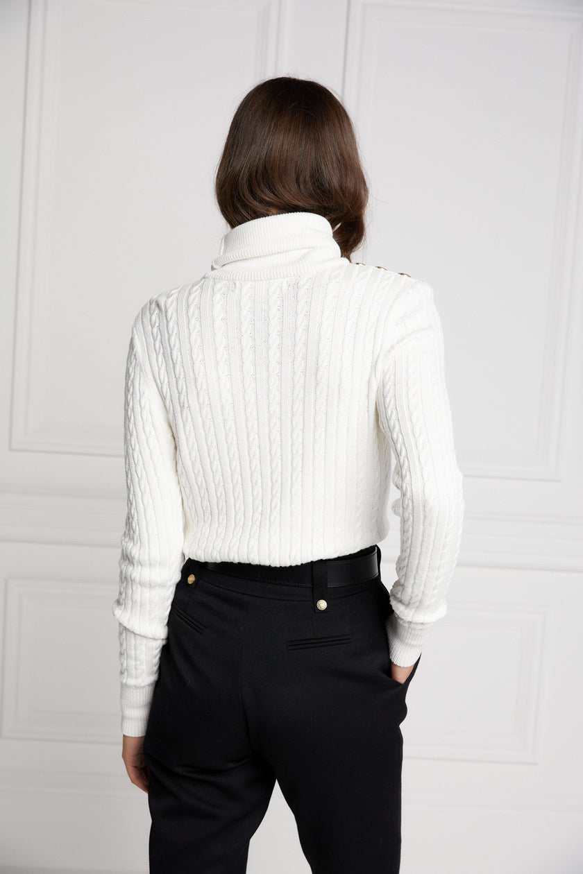 womens cable knit jumper in white with ribbed roll neck cuffs and hem