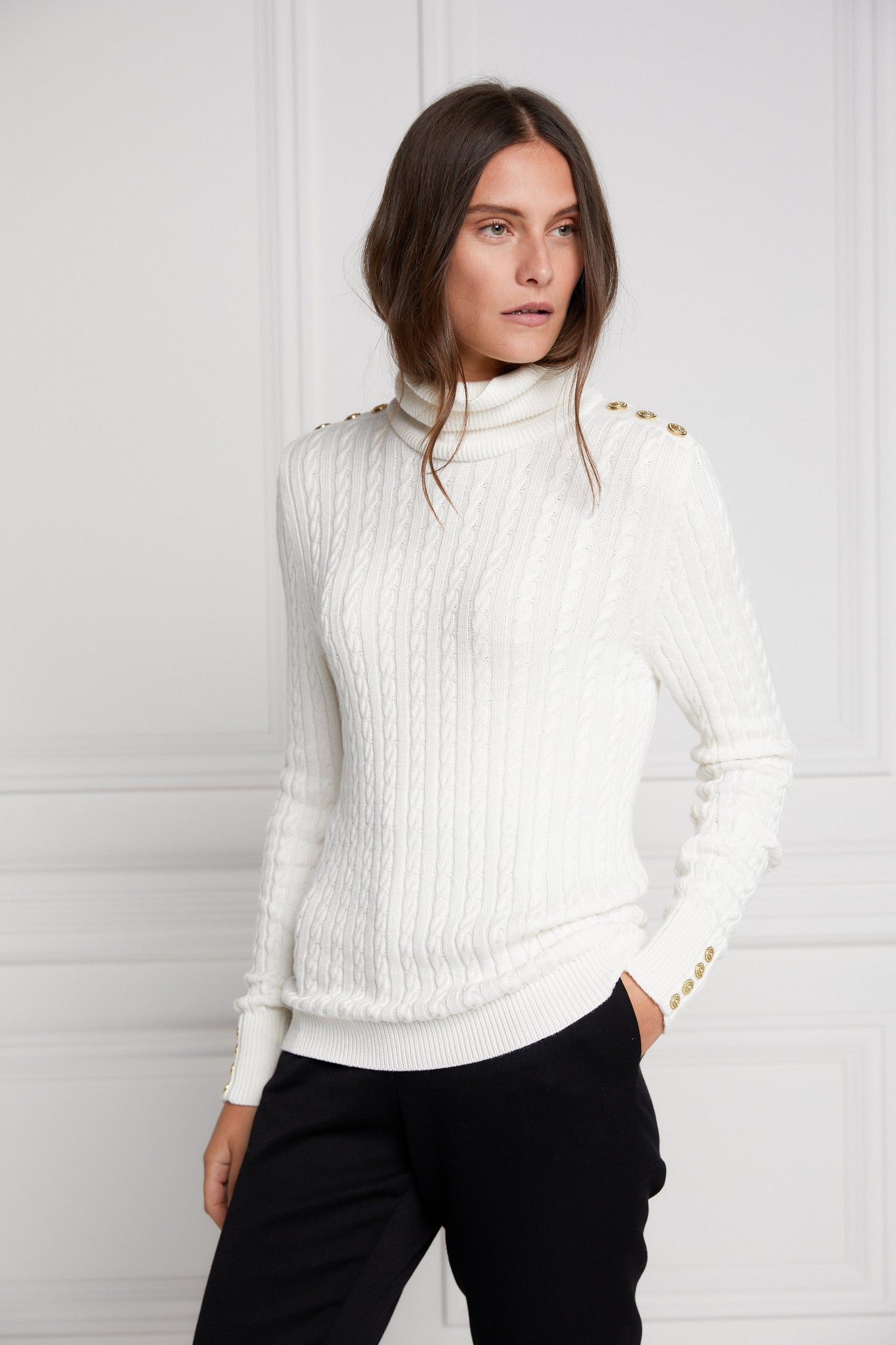 womens cable knit jumper in white with ribbed roll neck cuffs and hem