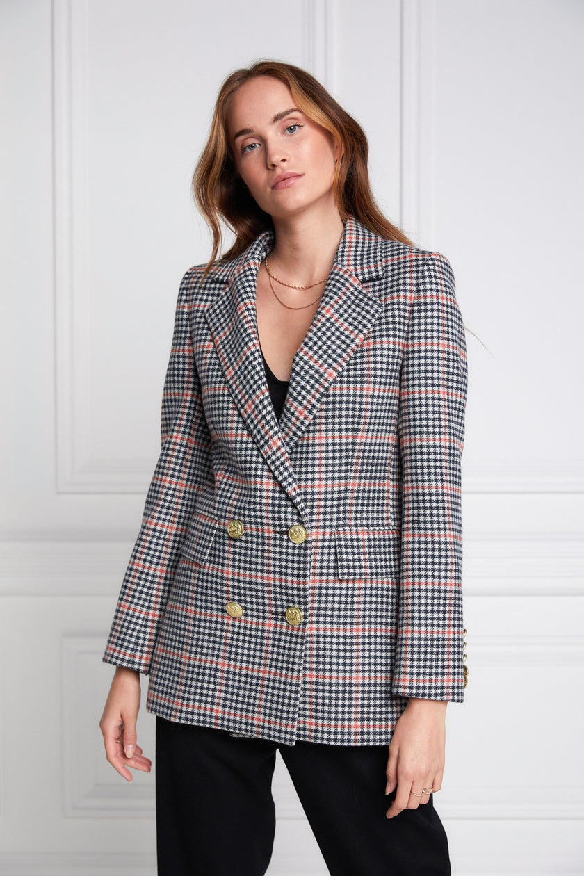 double breasted wool blazer in black white and pink check with two hip pockets and gold button details down front and on cuffs and handmade in the uk