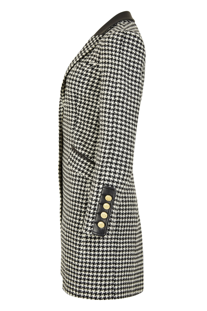 side of white and black houndstooth tweed womens coat with gold hardware and black leather detailing