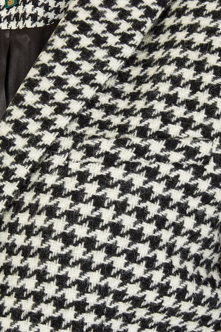 pocket detail of white and black houndstooth tweed womens coat with gold hardware and black leather detailing