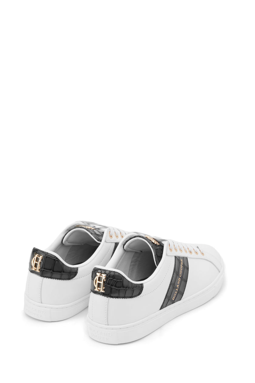 Back view of white leather trainer with white laces detailed with a diagonal stripe of black croc embossed leather with gold foil branding and a black croc embossed leather tongue and heel with gold hardware