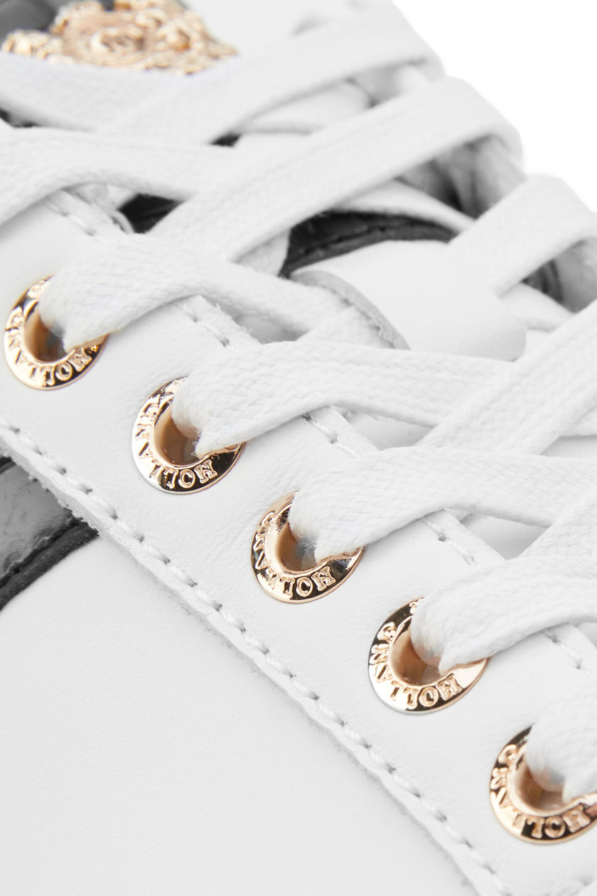 Close up of gold hardware on the laces for the trainer