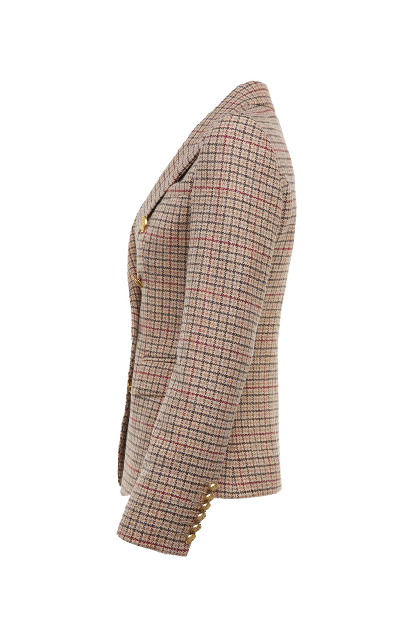 side of British made double breasted blazer that fastens with a single button hole to create a more form fitting silhouette with two pockets and gold button detailing this blazer is made from camel black and red check charlton tweed