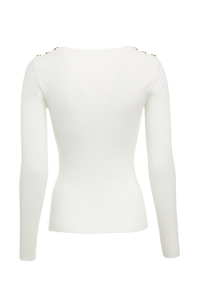 back of a form fitting finely ribbed long sleeved knitted top in cream with a sweetheart neckline and gold buttons on shoulders