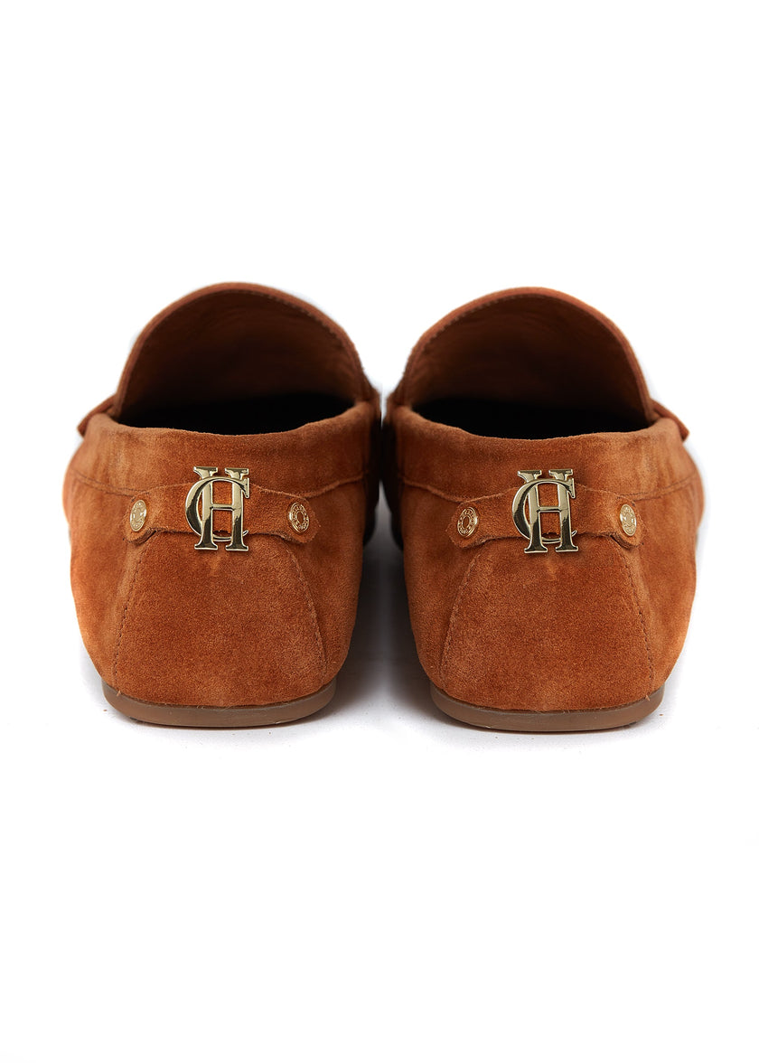 back of classic tan suede loafers with a leather sole and gold hardware