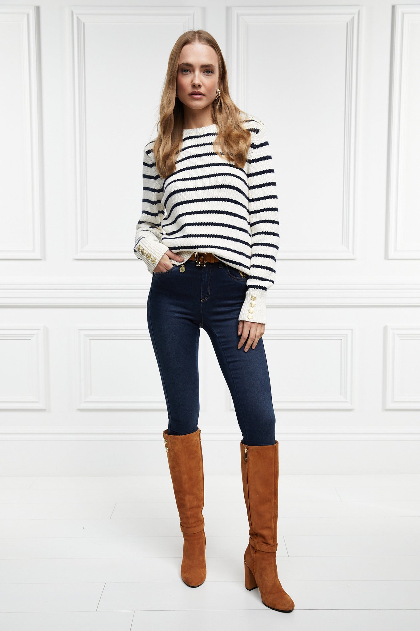 a classic cream and navy breton stripe crew neck jumper with a split ribbed hem and gold button detail on the cuffs and collar