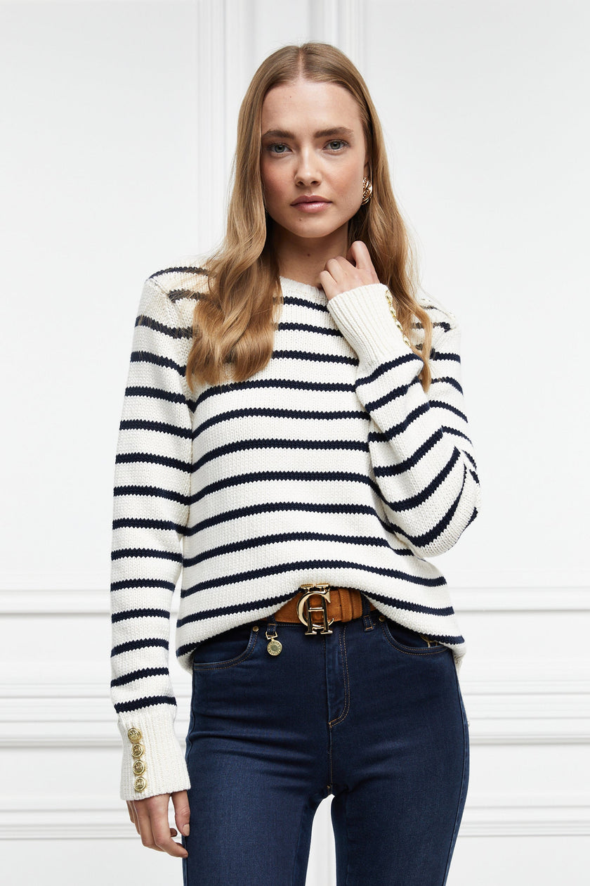 a classic cream and navy breton stripe crew neck jumper with a split ribbed hem and gold button detail on the cuffs and collar