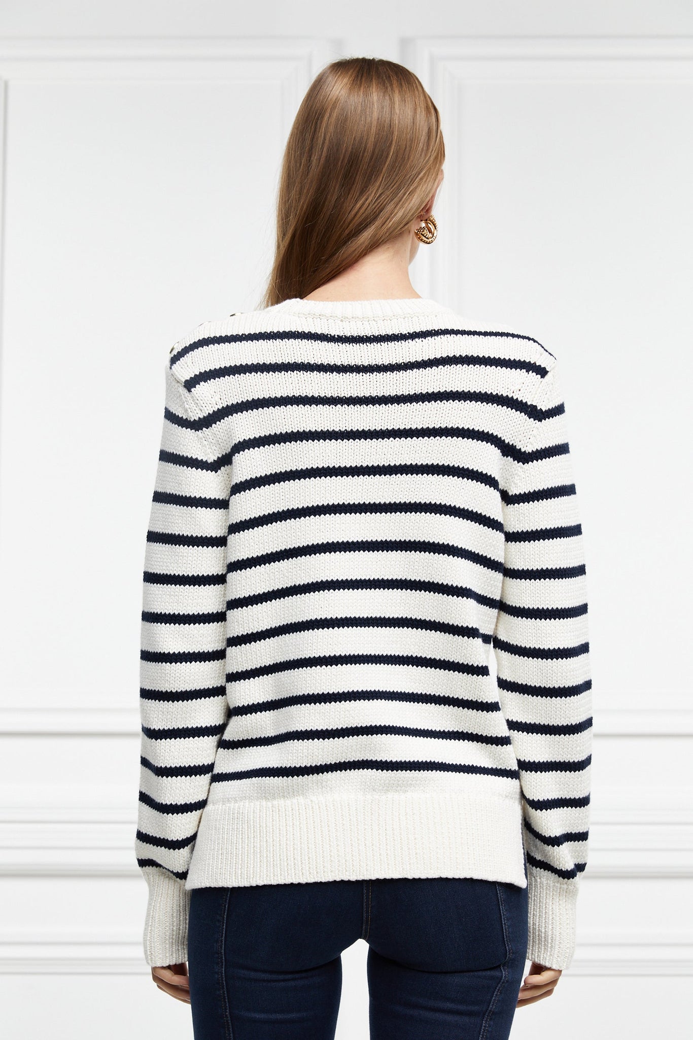 a classic cream and navy breton stripe crew neck jumper with a split ribbed hem and gold button detail on the cuffs and collar