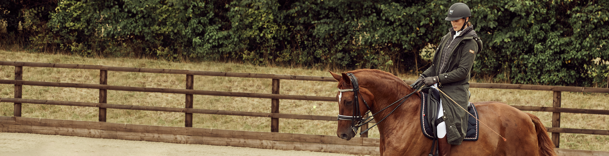 Horse rider with khaki longline training coat