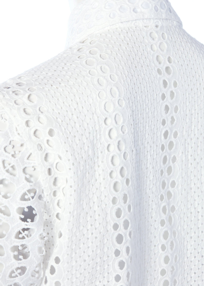 shoulder detail of womens long sleeve white cotton broderie anglaise shirt with voluminous sleeves and front buttons 