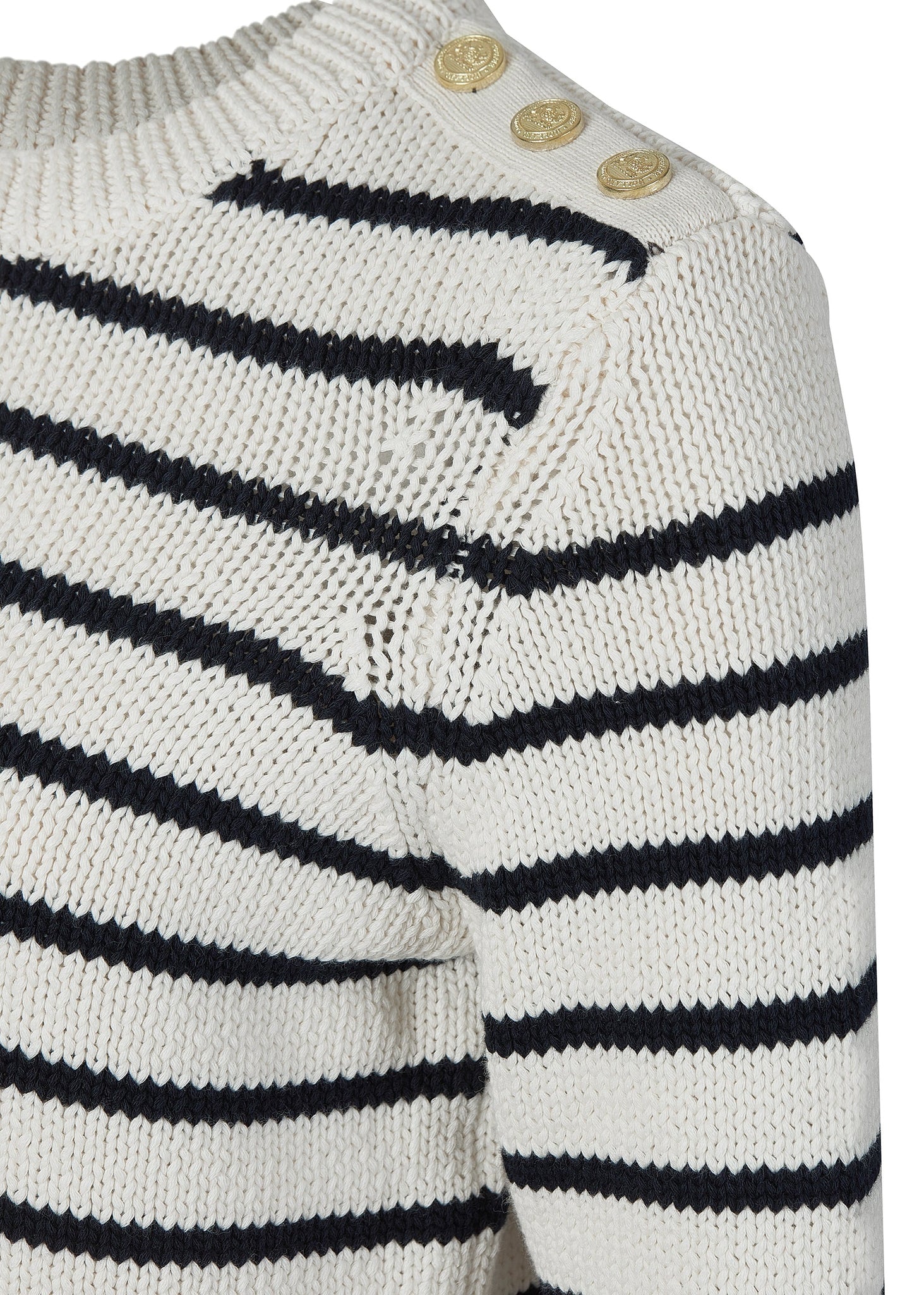 gold button shoulder detail on a classic cream and navy breton stripe crew neck jumper with a split ribbed hem and gold button detail on the cuffs and collar