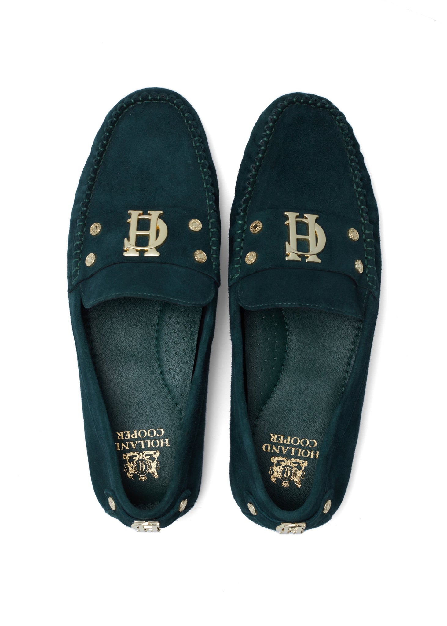 Birds eye view of classic emerald green suede loafers with a leather sole and top stitching details and gold hardware with a dark green inner sole