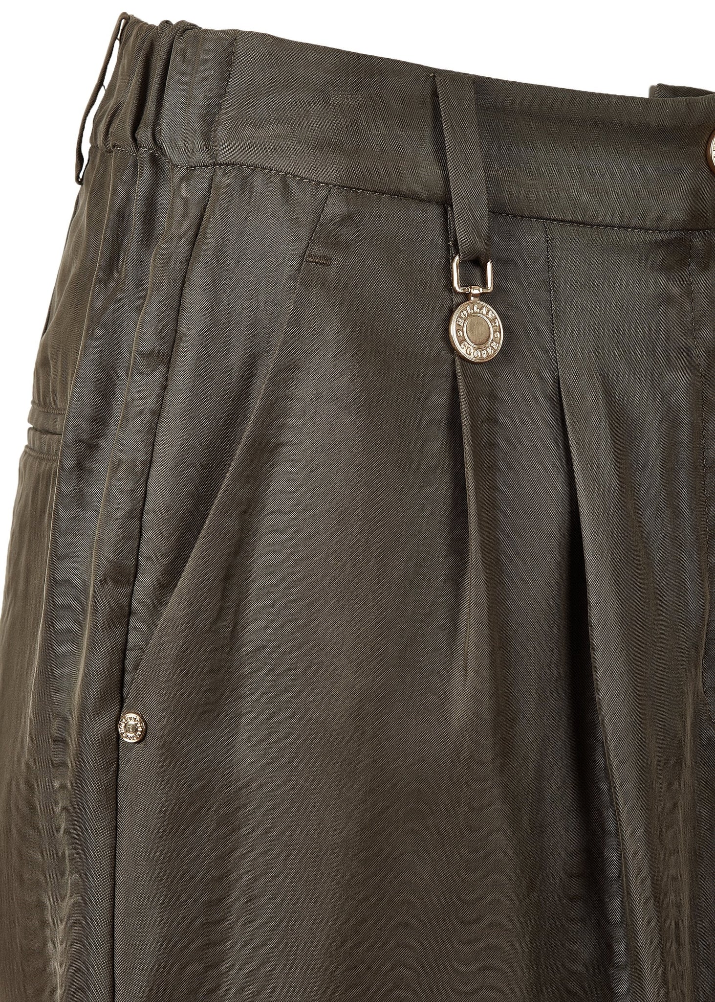 front pocket detail of womens khaki shorts with double front pleats and turned up hem with two open front pockets and centre front zip fly fastening and a gold button