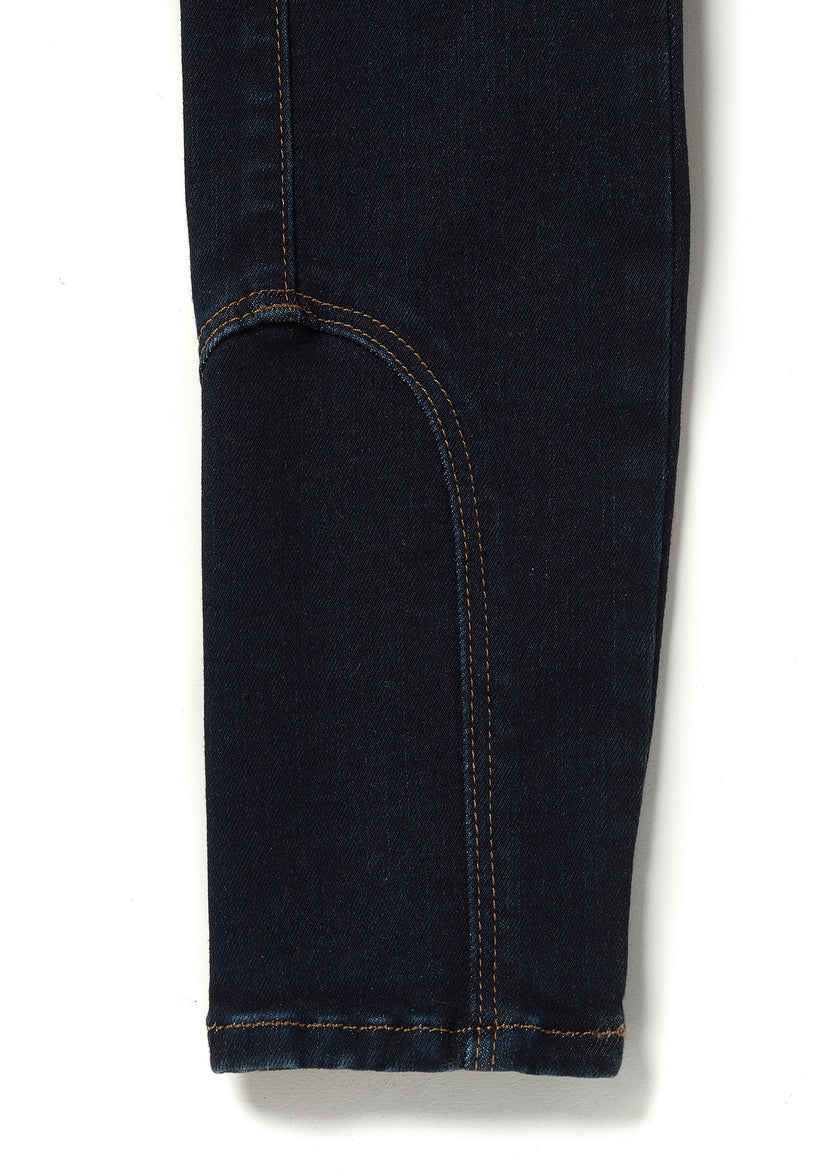 jodhpur style seams on womens high rise dark blue denim skinny stretch thermal jean with two open pockets to the front and back with internal fleece lining and gold hc crest on front right pocket