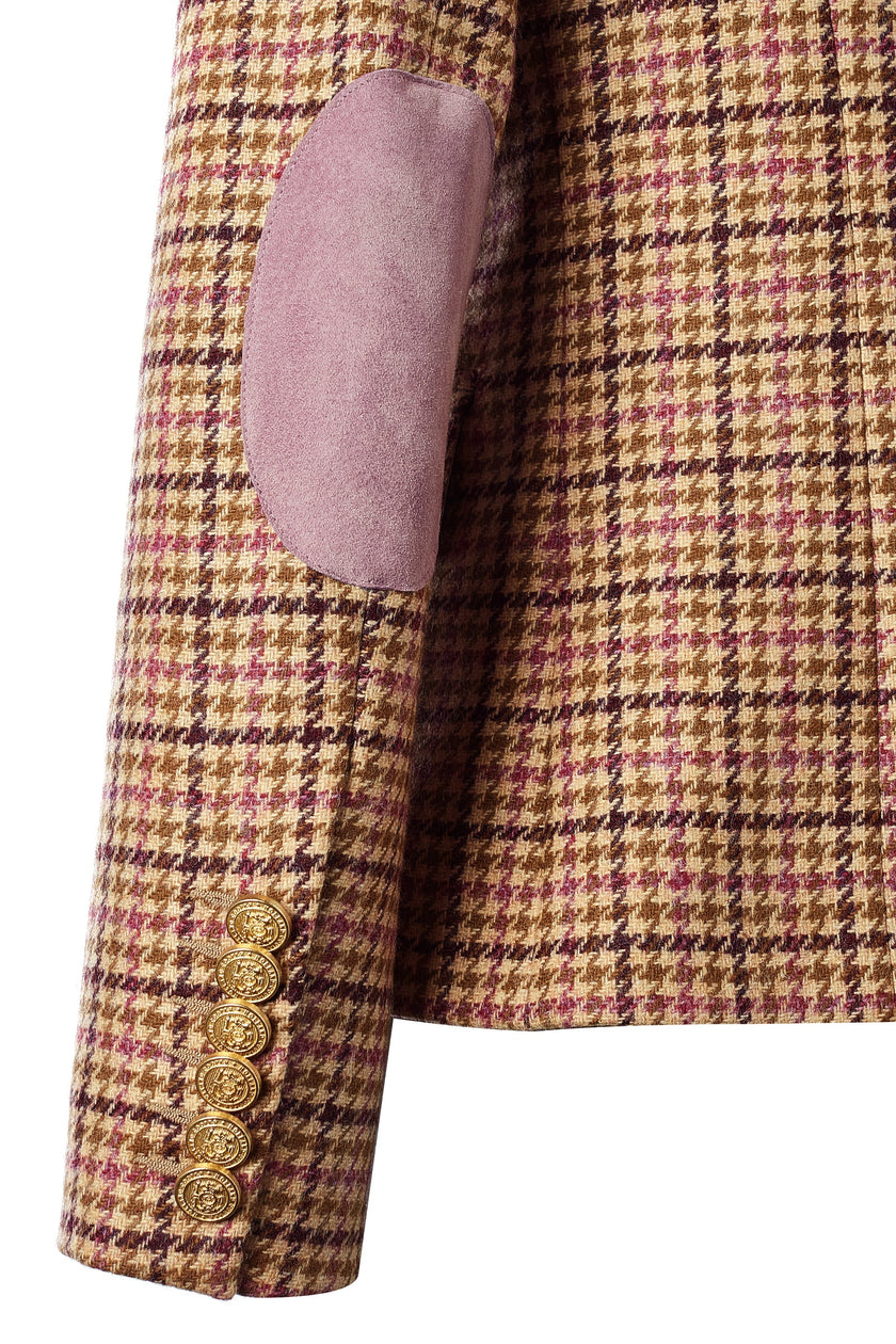 pink suede elbow patch and gold button detail on cuffs of British made double breasted blazer that fastens with a single button hole to create a more form fitting silhouette with two pockets and gold button detailing this blazer is made from pink purple and brown check houndstooth fabric