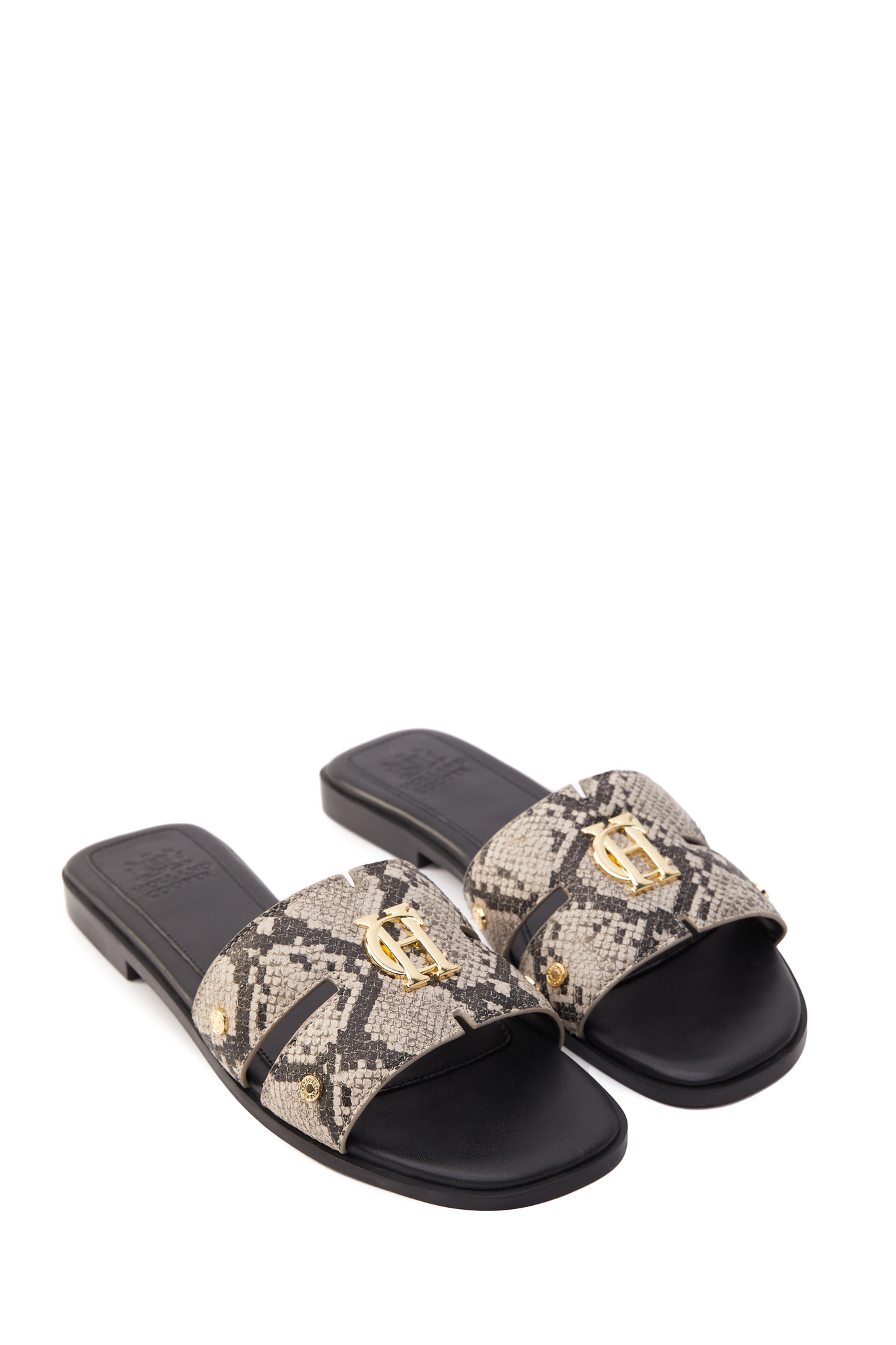 snake print embossed leather sliders with a black leather sole and gold hardware